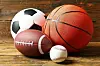 Sports balls on wooden background