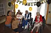 Four 100-year-olds enjoy some cake