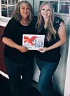 Mother & daughter hold their newly published book