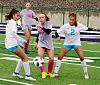 girls-soccer-in-the-rain