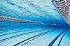 Olympic Swimming pool under water background.